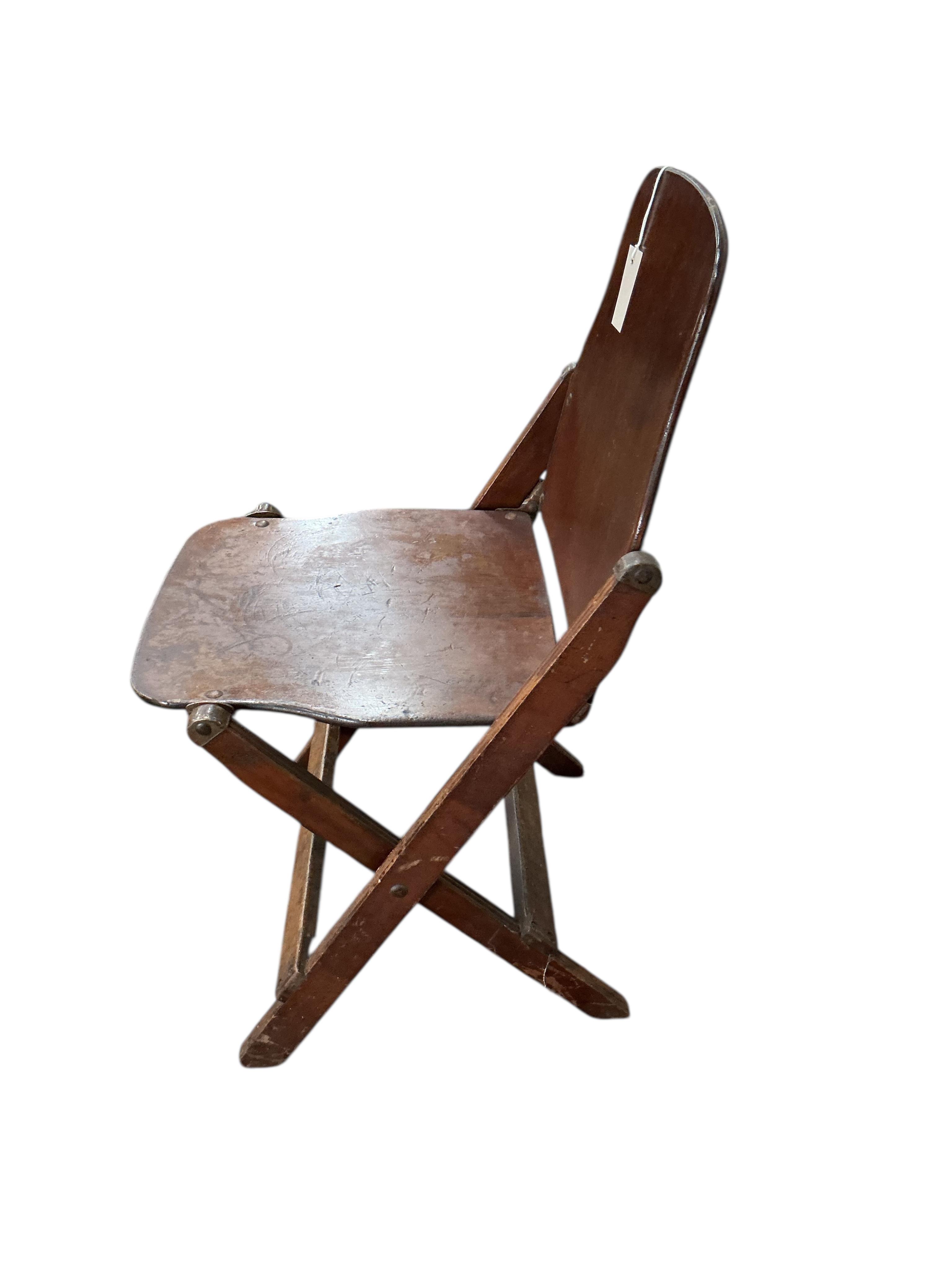A pair of US administrative folding chairs, India, width 43cm, depth 39cm, height 76cm